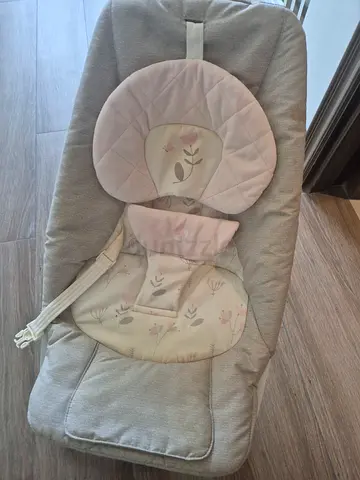 Neutral grey baby bouncer seat with floral insert - used