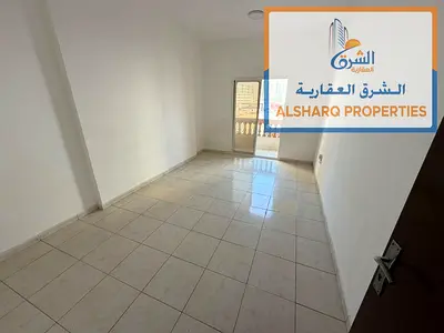 For rent in Al Nuaimiya 1, Ajman: a spacious unit featuring a separate bedroom and living room, a balcony, central air conditioning, and full maintena