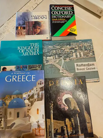 Set of travel and reference books including Greece, Saudi Arabia, Rotterdam, and images of Iran