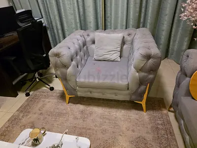 Green tufted single armchair with wooden legs - good condition
