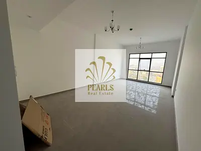 Annual Rent in Al Bustan, Ajman, near Port Street. Brand-new building, master bedroom, living room, sea view, balcony and free parking.