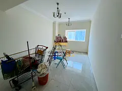 2BR in Al Majaz 2, master bedroom, 2 baths, spacious layout, open view, free parking, free maintenan