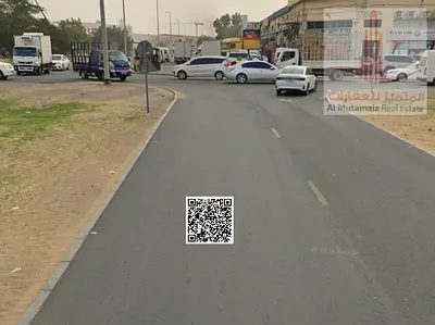 أرض سكنية تجارية للبيع في الجرف الصناعية 2 عجمان، على شارع جدة مباشرة، زاوية 3 شوارع، مساحة 10021 قدم مربع، تصريح بناء أرضي وطابقين، فرصة استثمارية مم