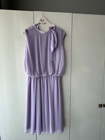 Dress by premium Turkish brand ROMAN. Elegant with a bow tied at the neck. Excellent condition