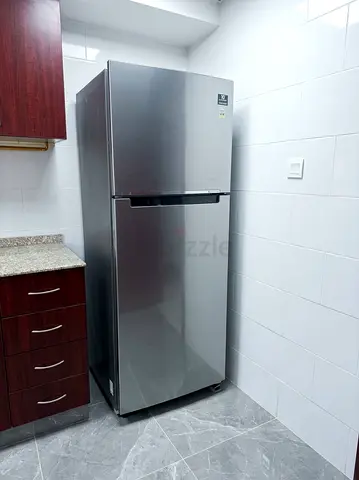 Silver double-door refrigerator (top freezer) - good condition