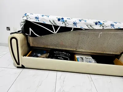 Single Three seater sofa cum storage bed with lift-up underbed compartment - cream faux leather
