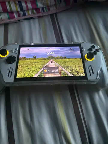 Portable handheld gaming console with 7-inch screen — lightweight, good condition