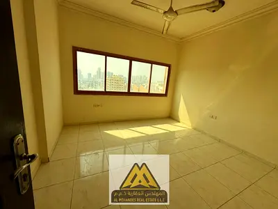 Studio in Al Rashidiya 2, separate kitchen, central AC. AED 18,008 yearly, payable in 4 or 6 installments.