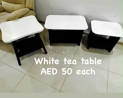 Set of 3 white-top tea/side tables — AED 50 each