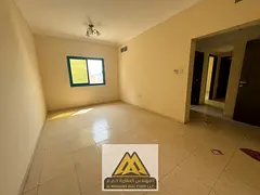 2BR apartment in Rashidiya 2, near Falcon Towers, 2 bathrooms, central AC. AED 35K yearly, 6 payment