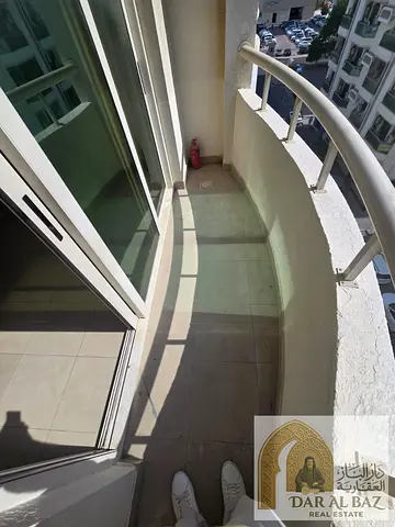 2BR apartment for annual rent in Abu Shagara, Sharjah. 2 bathrooms, balcony, central AC, spacious, open view, easy access to Dubai.