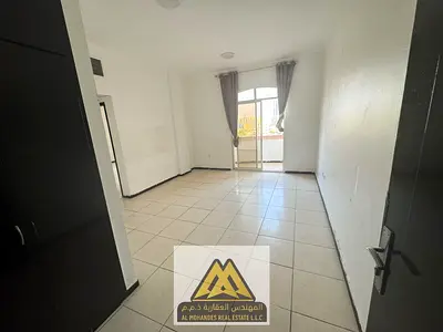 Spacious 1BR in Rashidiya 3, balcony, central AC, wardrobes, opposite Ajman One Towers. AED 26,004/
