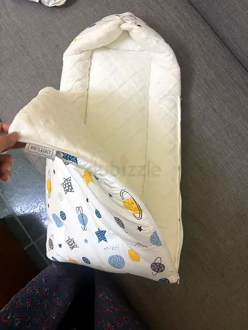 Portable baby nest/bassinet - light padded sleeper (used)