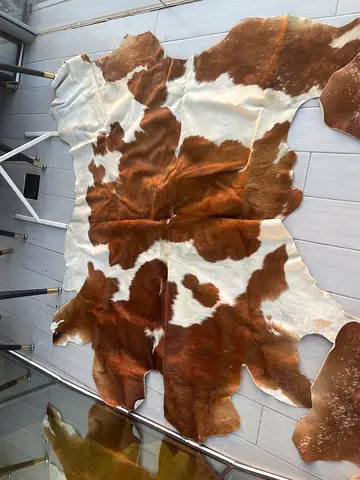 2 Genuine Brown & White Cowhide carpets - Large brought from London