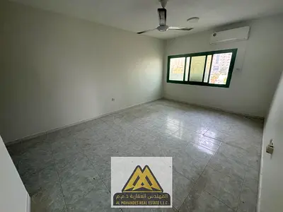 2BR in Rashidiya 3, split AC, balcony, 2 bathrooms, near services. AED 35,005 yearly, 6 payments.
