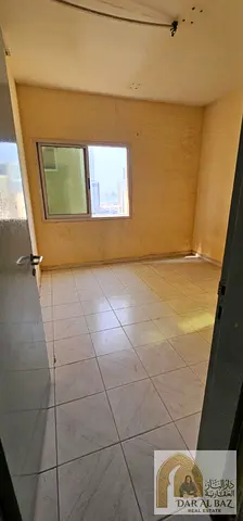 Two-bedroom apartment with a living room for annual rent in Al Nahda, Sharjah—located near Al Nahda Park. Features central air conditioning,