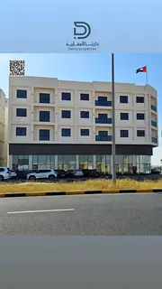New building for sale in Al-Alia Ajman | Income of one million dirhams per year | 10 shops and 22 re