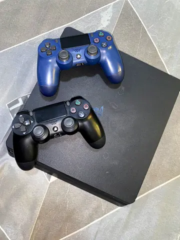PlayStation 4 with 2 DualShock Controllers - Good Condition + GTA 5