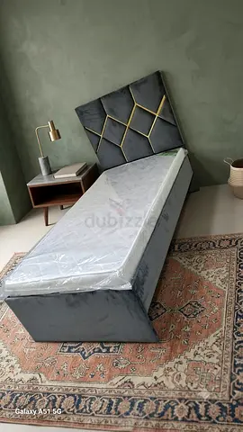 Queen upholstered bed with mattress — brand new