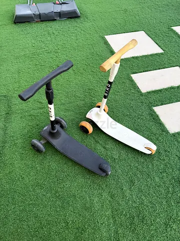Two Micro Mini Kick Scooters — Black and White, good condition