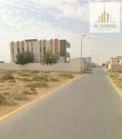 Residential plot for sale in Al Raqibah, Sharjah—a prime location situated on a corner.