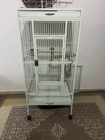 Large white metal bird cage on wheels — good condition