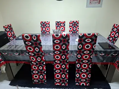 Dining table set with 8 patterned high-back chairs (used)