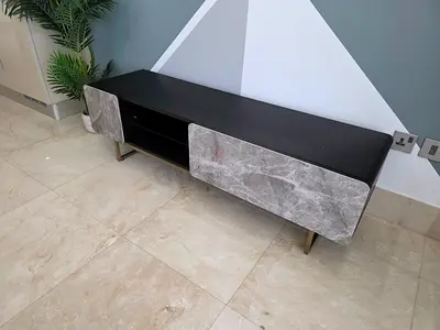 Low TV Entertainment Unit with Marble-Style Doors — Black Top, Gold Legs