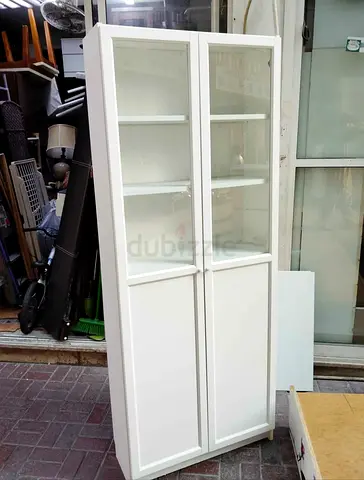 White tall cabinet with glass doors - 4 shelves, good condition