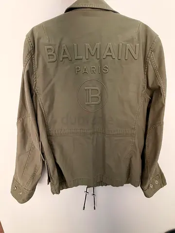 Balmain Khaki Cotton Military Jacket featuring vertical zipped chest pockets, dual lower zipped/$%&!