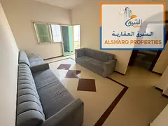 One-bedroom apartment with a living room and balcony, near Ajman Corniche; spacious, 25,000.