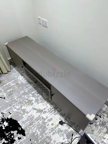 Minimalist low TV cabinet / media console in light grey wood finish