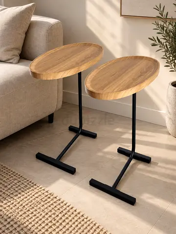 MODERN Pair of oval wooden side tables with black metal bases