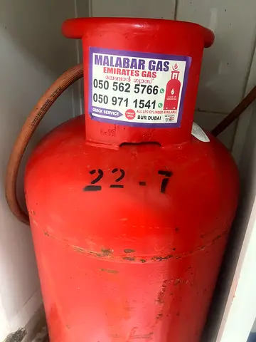22.7kg emirates gas with hose regulator almost full LPG gas cylinders - used (20L approx) for sale