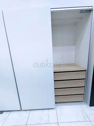 White sliding wardrobe with 4 wooden drawers — good condition