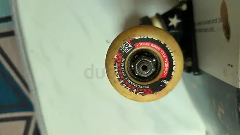 Used Street Skateboard with Graphic Deck and Worn Wheels.