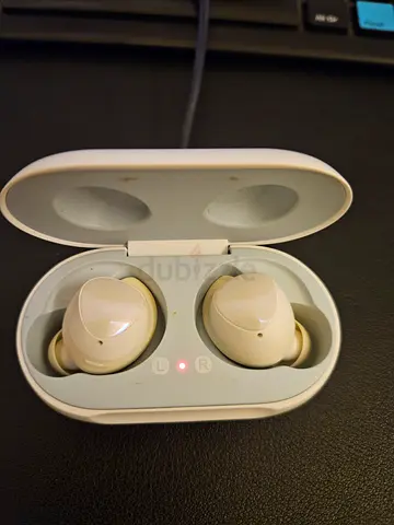 Used white true wireless earbuds with charging case - good condition