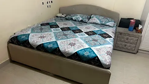 Queen upholstered bed frame with mattress and bedside table