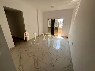 2BR Annual Rent in Al Alia, Ajman, 2 Master Bedrooms, 2 Balconies, 3 Baths, Central AC, Easy Payments, Great Price AED 35,000, Near Road 311