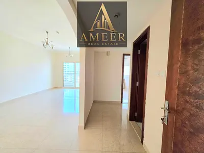 BRIGHT AND SPACIOUS 2 BR WITH PARKING FREE FAMILY TOWER WELL MAINTAINED EASY ACCESS TO DUBAI