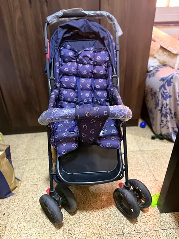 Lightweight baby stroller/pram with padded seat - good condition