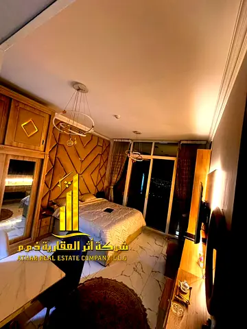 استوديو  مطبخ منفصل  اطلالة مفتوحة مع بلكونة بعجمان - الراشدية1 - ابراج الواحة -  مفروش  للايجار الشهرى