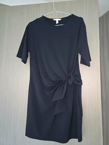 Black knee-length dress with front tie detail, short sleeves - gently used
