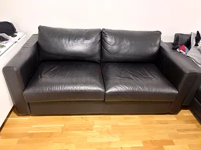 leather 2-seater sofa bed in good condition