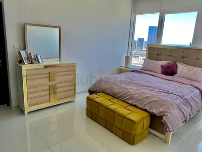 King size bed with tufted headboard, dresser and ottoman - very good condition