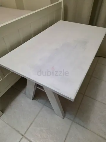 Solid white wooden dining table - simple design