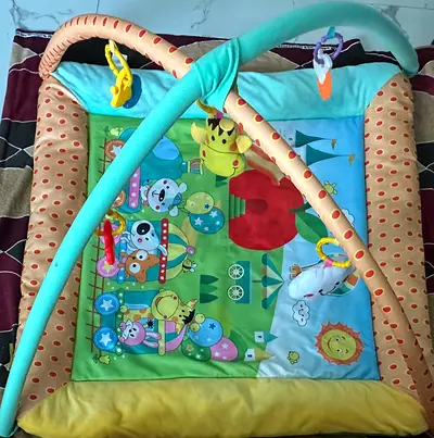 Baby play gym activity mat with hanging toys - gently used