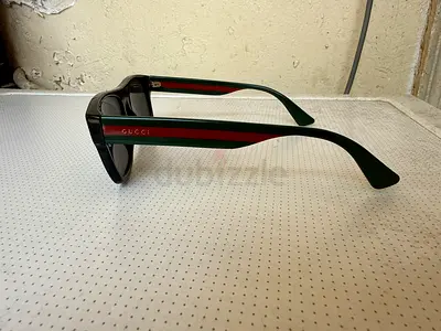 Authentic Gucci GG0341S Sunglasses in excellent condition. These luxury sunglasses feature a bold, m