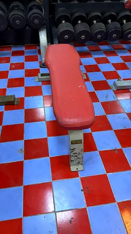 Flat weight bench with padded red seat - used