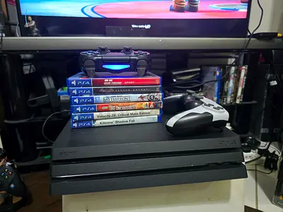 Sony PS4 PRO 1 tb with 2 Controllers and 6 PS4 Games - Good Working Condition